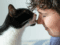 cat biting owners nose