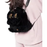 woman wearing fluffy cat backpack